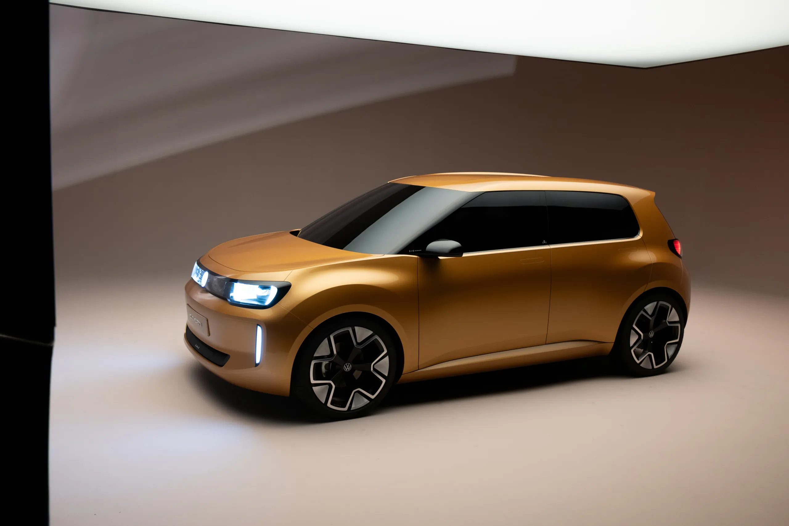 Yellow Volkswagen ID. EVERY1 in side view in the photo studio for the social media campaign